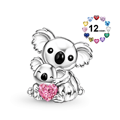 Koala abraza el amuleto de piedra de nacimiento del corazón de bebé
